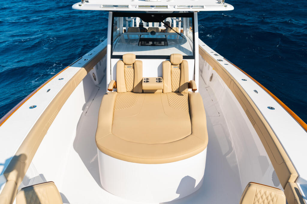 Overhead view of a center console boat's spacious tan seating and open deck on deep blue water